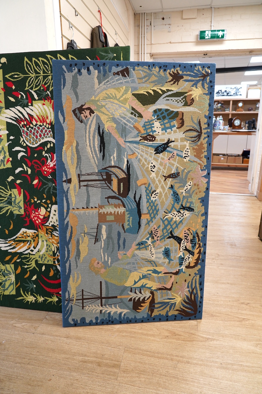 A French modernistic needlework panel of fishermen with nets possibly a local Brittany scene, 137cmwide x 78cm high. Condition - good